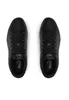 A top-down view of a pair of black Puma sneakers on a white background. Produktbild-Vorschau
