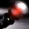 A close-up, dramatic shot of a flashlight head with its light emitting. Anteprima dell’immagine prodotto