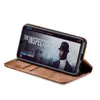 A smartphone in a brown flip case is displayed on a white background, showing a movie poster on its screen. Produktbild-Vorschau