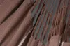 Close-up view of a brown fabric hammock with visible rope details. Produktbild-Vorschau