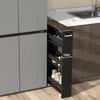 A narrow, multi-tiered rolling cart filled with jars and containers, positioned next to a large gray refrigerator and a kitchen counter with a sink. Produktbild-Vorschau