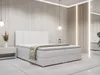 A white boxspring bed with a headboard and a beige throw blanket is shown in a modern bedroom setting. Produktbild-Vorschau