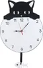 A black and white cat-shaped wall clock with a pendulum shaped like a fish skeleton. Produktbild-Vorschau