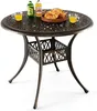 A round outdoor table with decorative elements and a basket of croissants and drinks on top. Produktbild-Vorschau