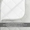 A close-up view of a quilted blanket, showing the stitching pattern and a folded edge. Text overlay describes the quilting. Produktbild-Vorschau