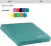 A teal balance pad is shown in the foreground, with a selection of colored circles representing color options in the background. Podgląd zdjęcia produktu