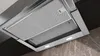 A close-up, low-angle view of a modern kitchen range hood, showing its metallic filters and integrated LED lights. Voir les images du produit