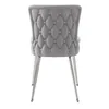 A rear view of a gray tufted dining chair with silver metal legs, isolated on a white background. Podgląd zdjęcia produktu