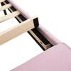A close-up view of the wooden slats and pink upholstered frame of a bed. Produktbild-Vorschau