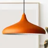 A close-up shot of an orange pendant light. Produktbild-Vorschau