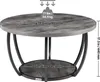A round, two-tiered coffee table with a gray wood-grain top and black metal legs, shown with dimensions and weight capacity indicated. Voir les images du produit