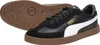 A pair of black Puma sneakers with white accents and a gum sole, shown from a slightly elevated side view with one shoe in focus and the other slightly behind and to the side. Voir les images du produit