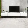 A modern white TV stand with a black TV on top, placed against a textured gray wall. Produktbild-Vorschau