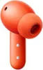 A close-up studio shot of an orange wireless earbud. Náhled obrázku produktu