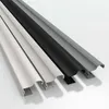 Three pieces of trim in different colors (white, black, and gray) are arranged diagonally on a white background. Produktbild-Vorschau