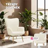 A modern armchair with gold legs is featured in a room with large plants and natural light. A smaller inset image shows the armchair again with a checkmark and text. Náhled obrázku produktu