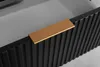 A close-up view of a black cabinet drawer with a gold handle. Anteprima dell’immagine prodotto
