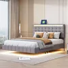 A modern bedroom with a grey upholstered bed featuring LED lighting.