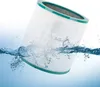 A cylindrical air filter is partially submerged in water, with water splashing around it. Produktbild-Vorschau