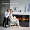 A woman and a child are sitting in front of an electric fireplace. Náhled obrázku produktu