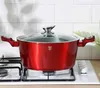 A red pot with a glass lid sits on a white stovetop. Voir les images du produit