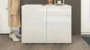 A white, glossy chest of drawers with two doors and two drawers is shown in a hallway setting, with a coat and shoes nearby. Produktbild-Vorschau