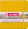 A yellow sketchbook with a white band of text and graphics around it. Voir les images du produit