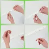 A collage of four images showing the assembly steps of a clothes drying rack. Produktbild-Vorschau