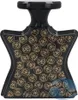 A black perfume bottle with gold circular patterns. Náhled obrázku produktu