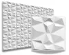 A close-up view of white 3D wall panels with a geometric, faceted design. One panel is shown in full, while another larger section is partially visible in the background. Produktbild-Vorschau
