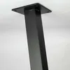 A close-up shot of a black metal table leg attached to a flat mounting plate. Náhľad obrázku produktu
