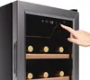 A close-up of a wine cooler with a hand interacting with the digital display. Náhľad obrázku produktu