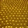 A close-up, overhead view of a net of warm white LED lights spread out on a yellow surface. Náhled obrázku produktu