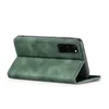 A green flip case for a smartphone is shown from a side angle, propped open. Produktbild-Vorschau