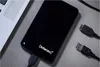 A black external hard drive is connected to a laptop with USB cables. Produktbild-Vorschau