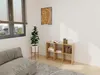 A living room scene with a sofa, rug, plant, and a cube shelf filled with books. Produktbild-Vorschau