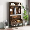 A rustic-style hall tree with storage and seating, placed in a room with plants and curtains. Podgląd zdjęcia produktu