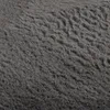 A close-up view of a gray shaggy rug. Voir les images du produit