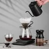 A person is making pour-over coffee using a coffee set. Voir les images du produit