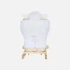 A white plush sheep toy sitting on a wooden sled, viewed from the back. Produktbild-Vorschau