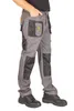 A person wearing work pants and work boots, shown from the side. Náhled obrázku produktu
