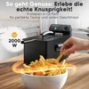 A hand is shown taking french fries from a bowl of fried food, with a deep fryer in the background. Produktbild-Vorschau