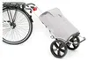A shopping trolley attached to the rear wheel of a bicycle, shown against a white background. Podgląd zdjęcia produktu