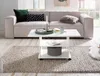 A modern living room scene featuring a couch, coffee table, and rug. Voir les images du produit