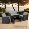 A rattan lounge set for four people is placed on a patio overlooking the ocean at sunset. Náhled obrázku produktu