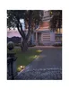 A stately home entrance at dusk, illuminated by path lights. Produktbild-Vorschau