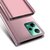 A close-up, angled view of a rose gold smartphone case with a clear flip cover, showing the camera module. Produktbild-Vorschau