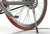 A close-up view of the rear wheel and kickstand of a bicycle. Anteprima dell’immagine prodotto