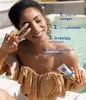 A woman is applying sunscreen to her face outdoors by a pool. Podgląd zdjęcia produktu