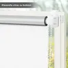 Close-up of a white roller blind attached to a window frame. Produktbild-Vorschau
